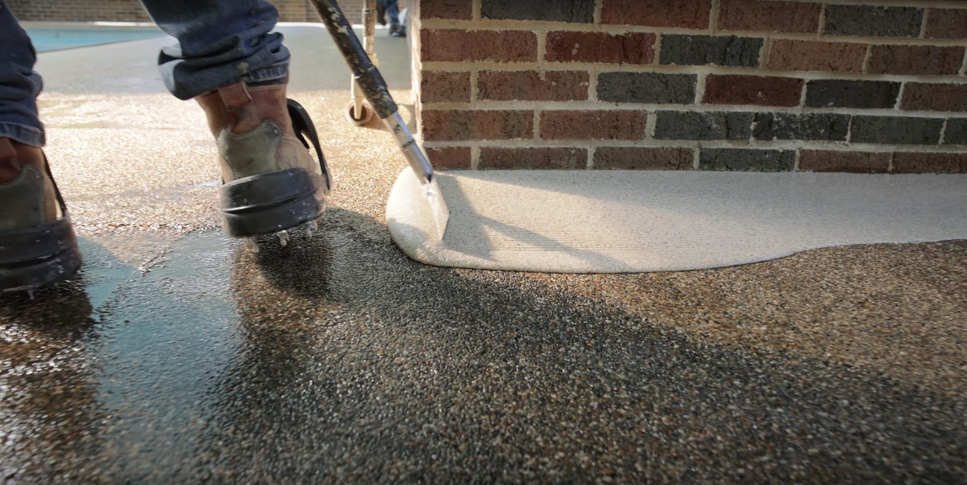 Exposed aggregate concrete driveway installation with professional finishing Exposed aggregate concrete driveway Mt Vernon VA - professional concrete finishing technique