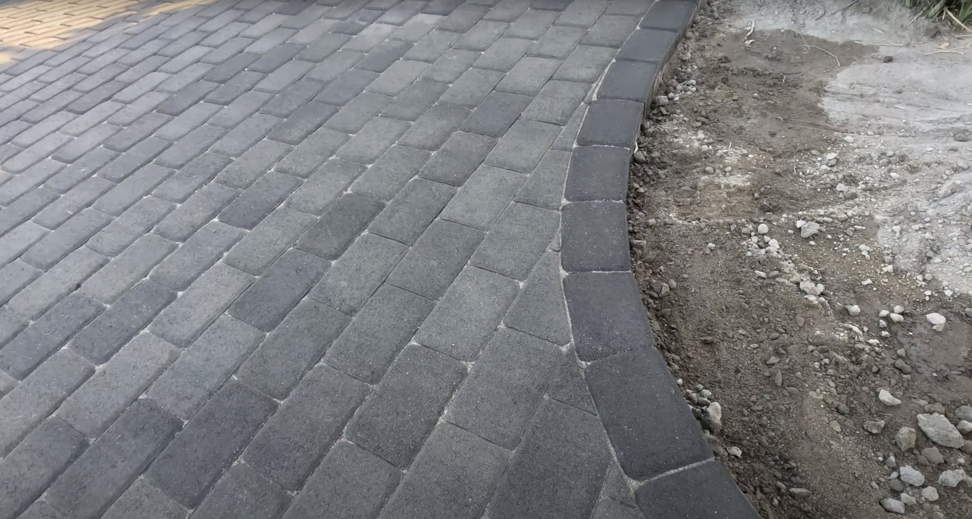 Professional concrete paver installation with precise alignment and spacing Concrete paver installation Mt Vernon VA - gray concrete pavers being installed