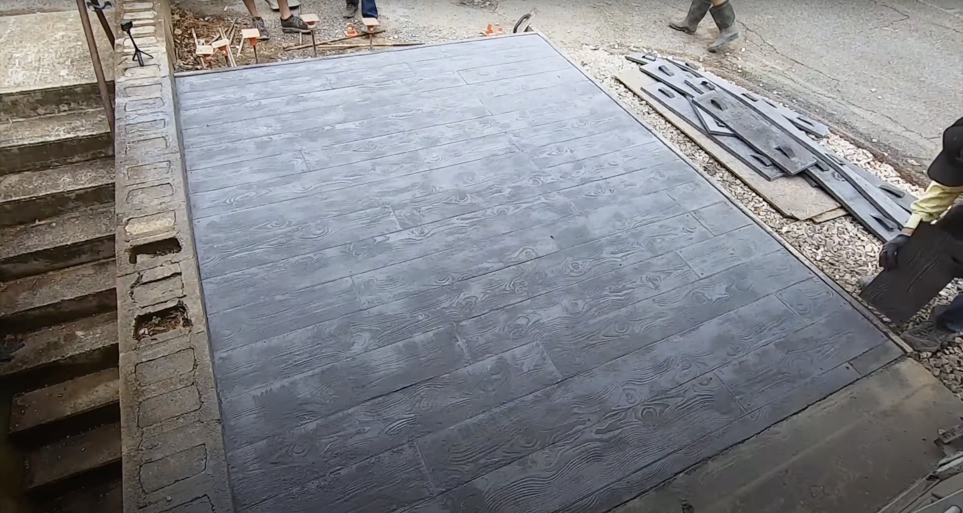 Stamped concrete patio with wood grain texture pattern installation Stamped concrete patio Mt Vernon VA - decorative wood grain pattern concrete surface